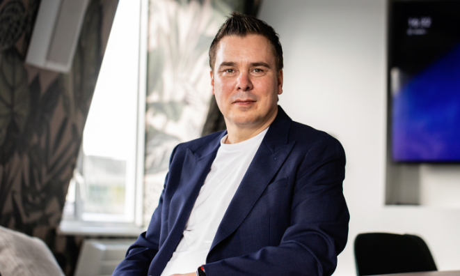 Roberto Neri in blue suit and white t-shirt